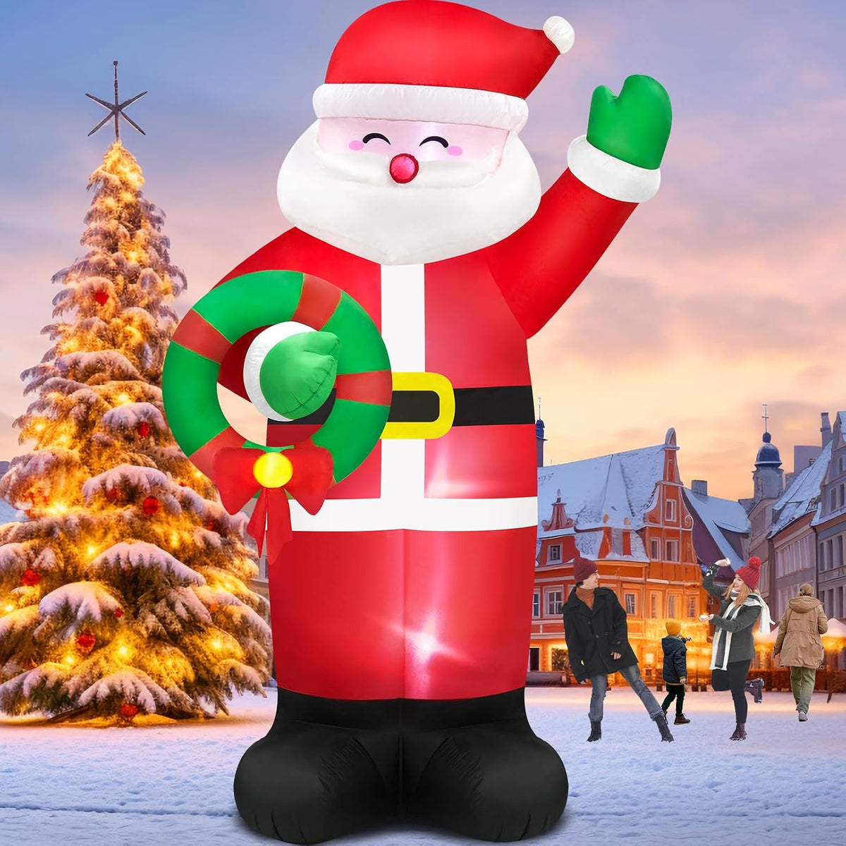 Giant Santa inflatable waving and holding a wreath in a snowy town square