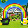 Rainbow arch inflatable with a LUCKY pot of gold and a frothy mug on a front lawn