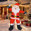 Santa inflatable with arms spread wide in front of a decorated porch with gifts and candy canes