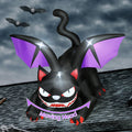 Black cat inflatable with purple bat wings and fangs crouched on a roof under a stormy sky