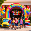 Rainbow ABC123 arch inflatable over a school entrance with children and a teacher walking through